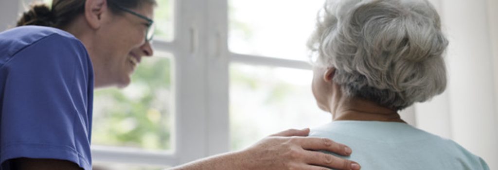 Nurse taking care of an old woman